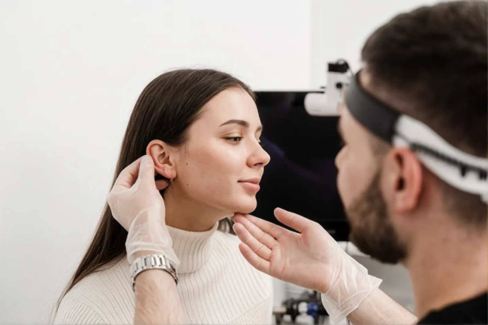 A patient being assessed at a plastic surgery consultation