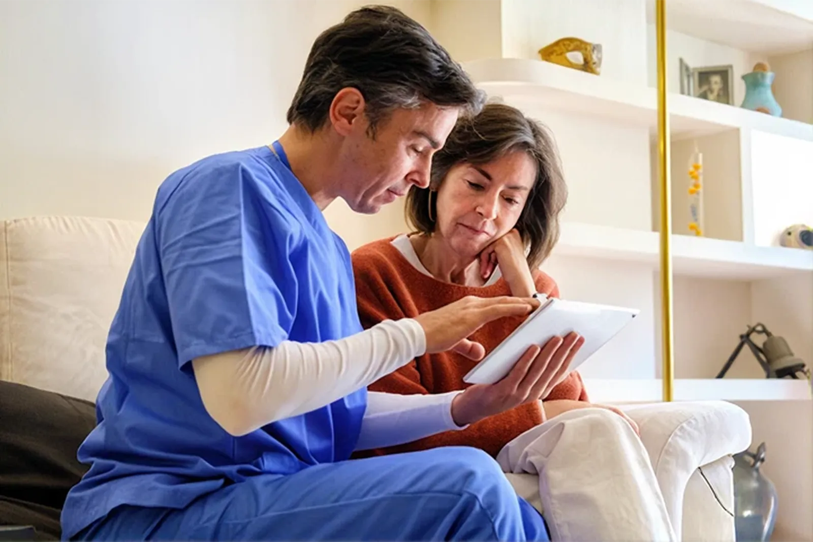 A nurse going through aftercare with a skin cancer patient